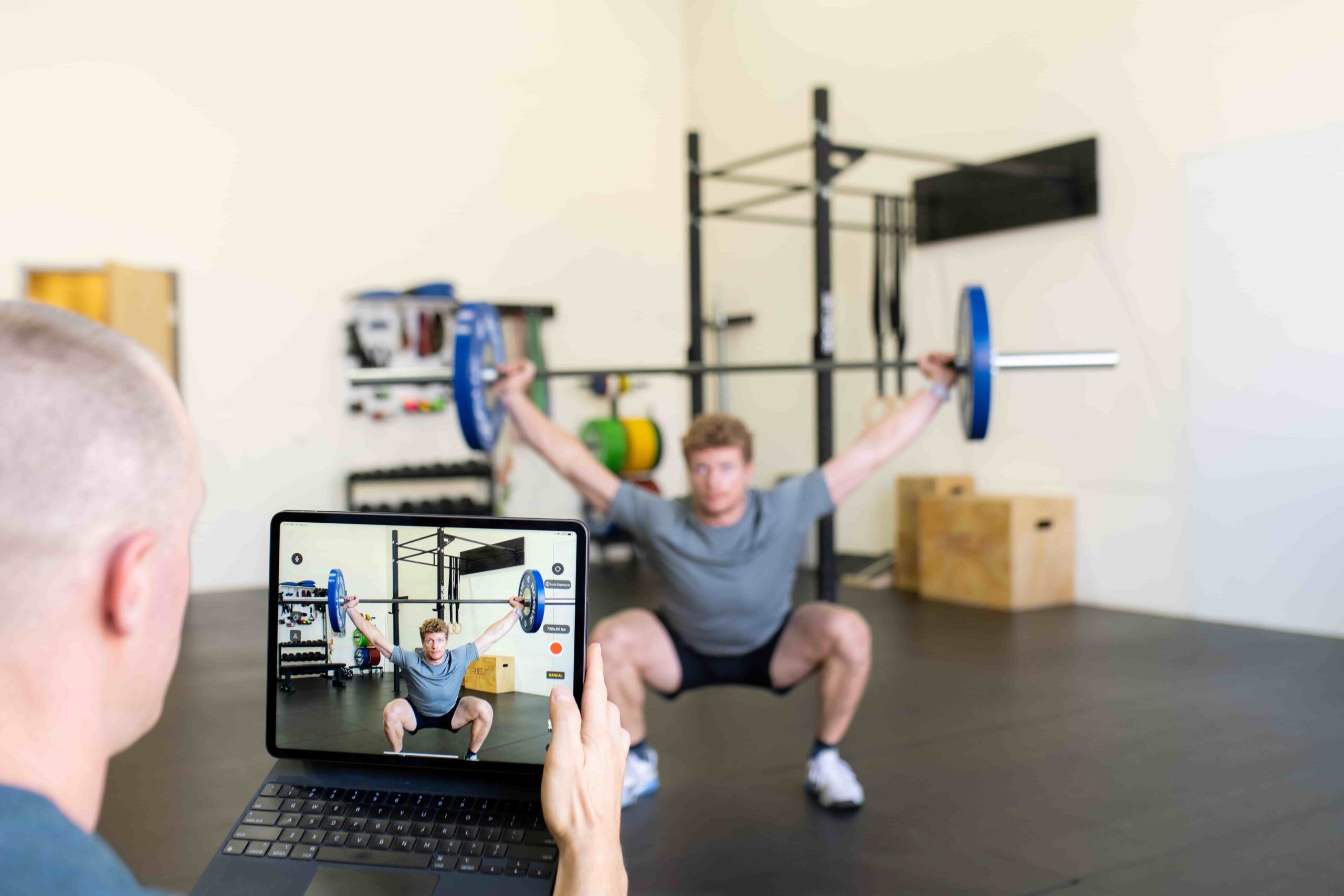 a man recording weightlifting